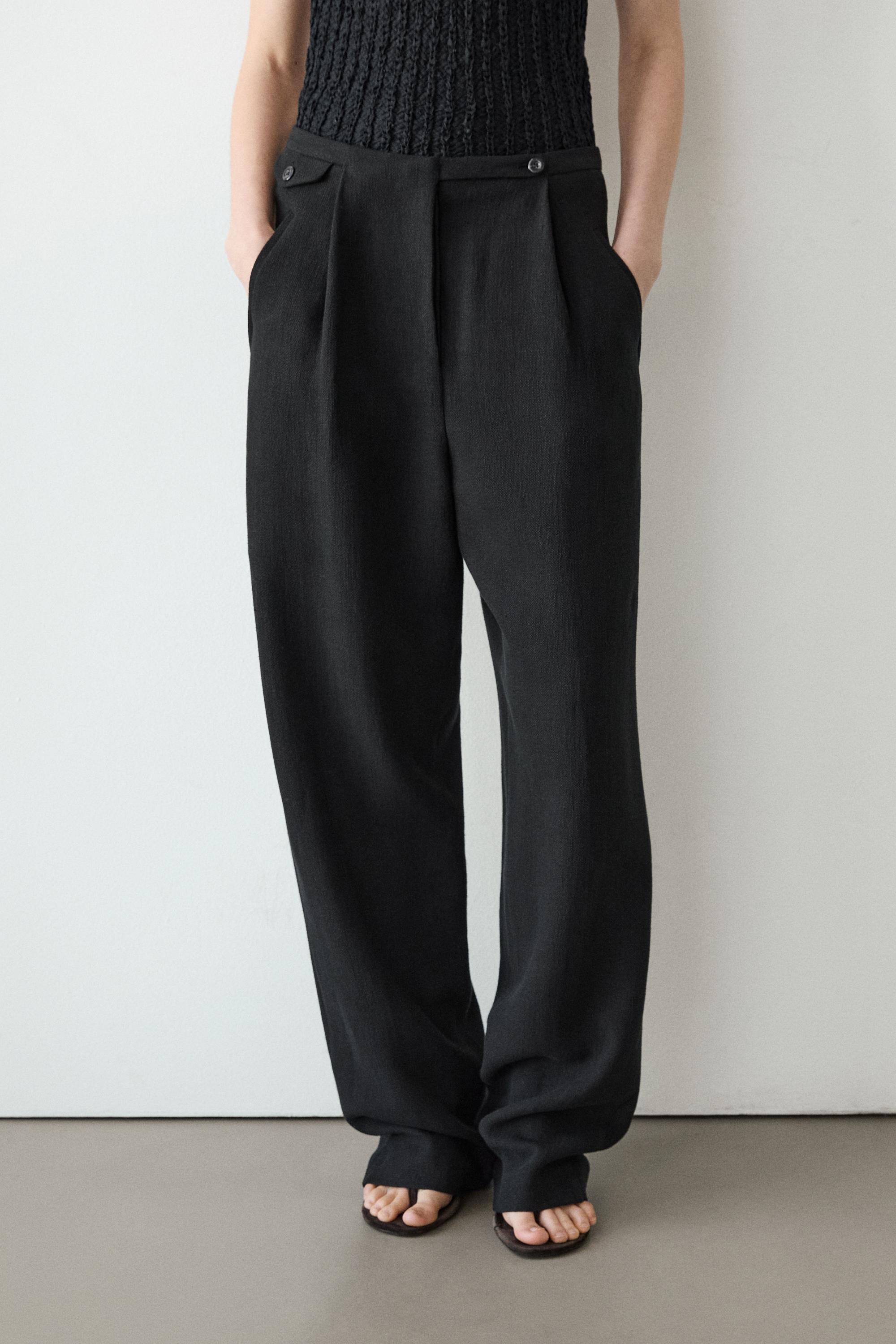 Flowing linen blend trousers with pocket details